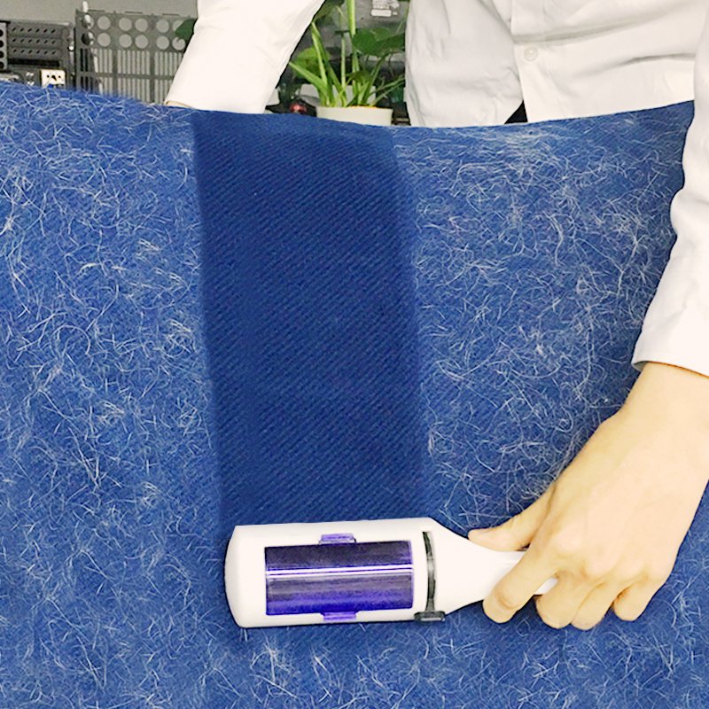 Pet hair removal roller in use